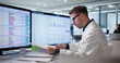 © Andrey Popov - Medical Billing Specialist Reviews Coding Invoices On Computer