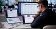© Andrey Popov - Man At Office Desk Analyzing Risk Data