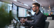 © Andrey Popov - Man Analyzes Medical Billing Data On Dual Laptop Screens