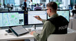 © Andrey Popov - Young Law Enforcement Officer Uses Digital Tools On Laptop