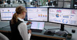 © Andrey Popov - Young Woman Studies Financial Charts On Laptop