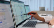 © Andrey Popov - Woman Reviews Patient Billing Codes On Laptop