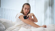 © Andrey Popov - Young Woman Happily Checks Glucose Level