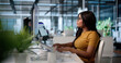 © Andrey Popov - Young African American Woman Uses Laptop To Assess Vendor Risk