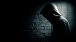 © LORD - Mysterious hooded hacker standing against brick wall with glowing binary code in dark moody lighting scene