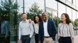 © ryker - business people walking and laughing outside an office building, colleagues enjoying a discussion and bonding, diverse partners in a casual meeting atmosphere