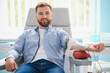 © Serhii - Man donating blood in clinic for healthcare and charity