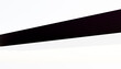 © ADDICTIVE STOCK - Black fabric strip on white background with copy space