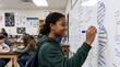 © IbragimovN - Student drawing dna helix on classroom whiteboard with focus on science education and learning in a school environment
