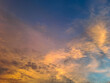 © ADP - A breathtaking view of a dramatic sunset or sunrise sky featuring colorful glowing clouds, blue and orange color gradients, and soft textures. Ideal for nature backgrounds, weather concepts, and inspi