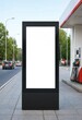 © SHAHJALAL - Blank billboard beside modern gas station with copy space for advertising, promotional campaigns, branding, roadside marketing, fuel retail, transportation, commercial messaging, and business communic