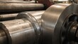© Justlight - Focused view of steel edge undergoing thickness reduction in reversing mill with rotating rolls prominent and peripheral parts gently blurred.