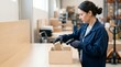 © SashaMagic - Warehouse worker scans barcode on package at fulfillment bench in bright modern distribution center - Order assembly