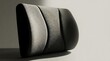 © MstDoli - Ergonomic black memory foam lumbar support cushion isolated on a white background for effective back pian relief and improved seated office posture health