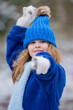 © Volodymyr - Winter child happy face. Kid winter face outdoor portrait. Child on snow covered in nature. Kid winter activity. Cute child enjoying a snowy winter day outside.