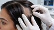 © Curioso.Photography - Dermatologist in medical gloves examining scalp and hair loss condition of female patient in clinic.