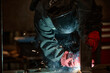 © Seventyfour - Male welder in protective mask welding metal parts in workshop. Image represents industrial manufacturing and is suitable for trade school marketing, close up shot