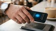 © Lin - Contactless payment success on smartphone screen showing checkmark and amount, hand holding device over NFC terminal at cafe counter, coffee cup nearby, wireless transaction