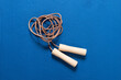 © Westend61 - Skipping rope on blue workout mat