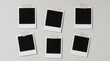 © TransPicHub - Six blank instant photo frames taped to a light gray wall in a neat, casual arrangement.