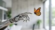© Shraddha - A robotic hand reaching out to touch a delicate butterfly in a modern indoor setting.