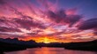 © IbragimovN - Vibrant sunset over mountain lake with dramatic colorful clouds