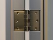 © Grace - Door hinge with bearing barrel on heavy commercial door edge in modern setting