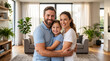 © mamo studios - Happy Caucasian family of three embracing and laughing together in modern brightly lit indoor living room