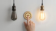 © sohel - Hand pressing glowing power button to activate creative light bulb