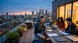 © PSCREATIVE - Young professionals collaborating on a rooftop terrace overlooking a city skyline at dusk