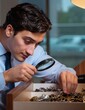 © roda - Man in casual attire using smartphone at table.