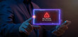 © kobps2 - Businessman finger touching glowing HUD warning alert window displaying NETWORK INTRUSION text with triangle icon. Enterprise network intrusion detection and security breach incident response concept.