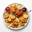 © Suci - Assortment of gourmet crispy nuggets with various dipping sauces isolated on white
