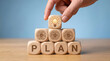 © Yusuf - Hand Placing Idea Cube On AI Plan Pyramid For Business Strategy