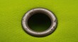 © Prasert - Detailed view of a worn metal grommet hole on bright fabric, suggesting attachment points and weathering ,abstract ,worn ,flag