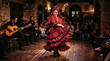 © GrayFrog - Passionate Spanish flamenco dancer in a red polka dot dress performing on stage with musicians and audience in a tavern.