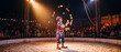 © MaksymFilipchuk - Colorful clown juggling balls in a circus ring during live nighttime performance for audience