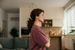 © La Famiglia - Woman meditating at home practicing mindfulness and yoga