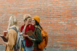 © La Famiglia - Diverse students walking on campus talking and smiling