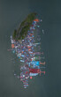 © Amazing Aerial - Aerial view of the stilt village of Ko Panyi with colorful rooftops, wooden piers, and floating structures in Ko Panyi, Phang Nga, Thailand.