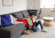 © Pixel-Shot - Young man with flag of France writing something in notebook at home