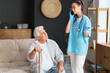 © Pixel-Shot - Senior man and nurse talking by mobile phone at home
