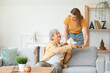 © Pixel-Shot - Young woman with her grandmother and tea at home