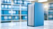 © novia - A Blue Binder Stands Open on a Desk in a Blurred Office Background.