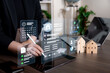© Bussarin - Business professional managing a virtual property dashboard with tenant records, scheduling, team structure, document checks, and performance data for efficient real estate administration.