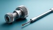 © Boonnam Burart - Close-up of metal gears and a precision tool on a teal background for industrial and engineering applications