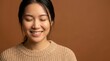 © nisi - Serene young woman with eyes closed wearing cozy knit sweater