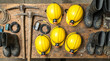 © DrewDuzz - a continuous layout of mining industry gear displaying heavy steel pickaxes yellow safety helmets battery powered headlamps and thick rubber boots for an underground worker
