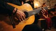 © Rizqy229 - Close-up hands playing spanish acoustic guitar in performance with musician