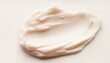 © Ike krisna - Creamy White Skincare Cosmetic Texture Swatch Isolated on a Neutral Background